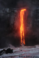 In the low light of morning, Lava falls pour over land's edge into the Sea.